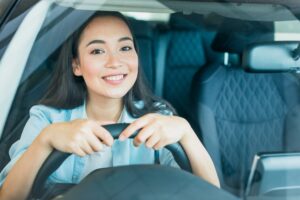 Happy woman driving